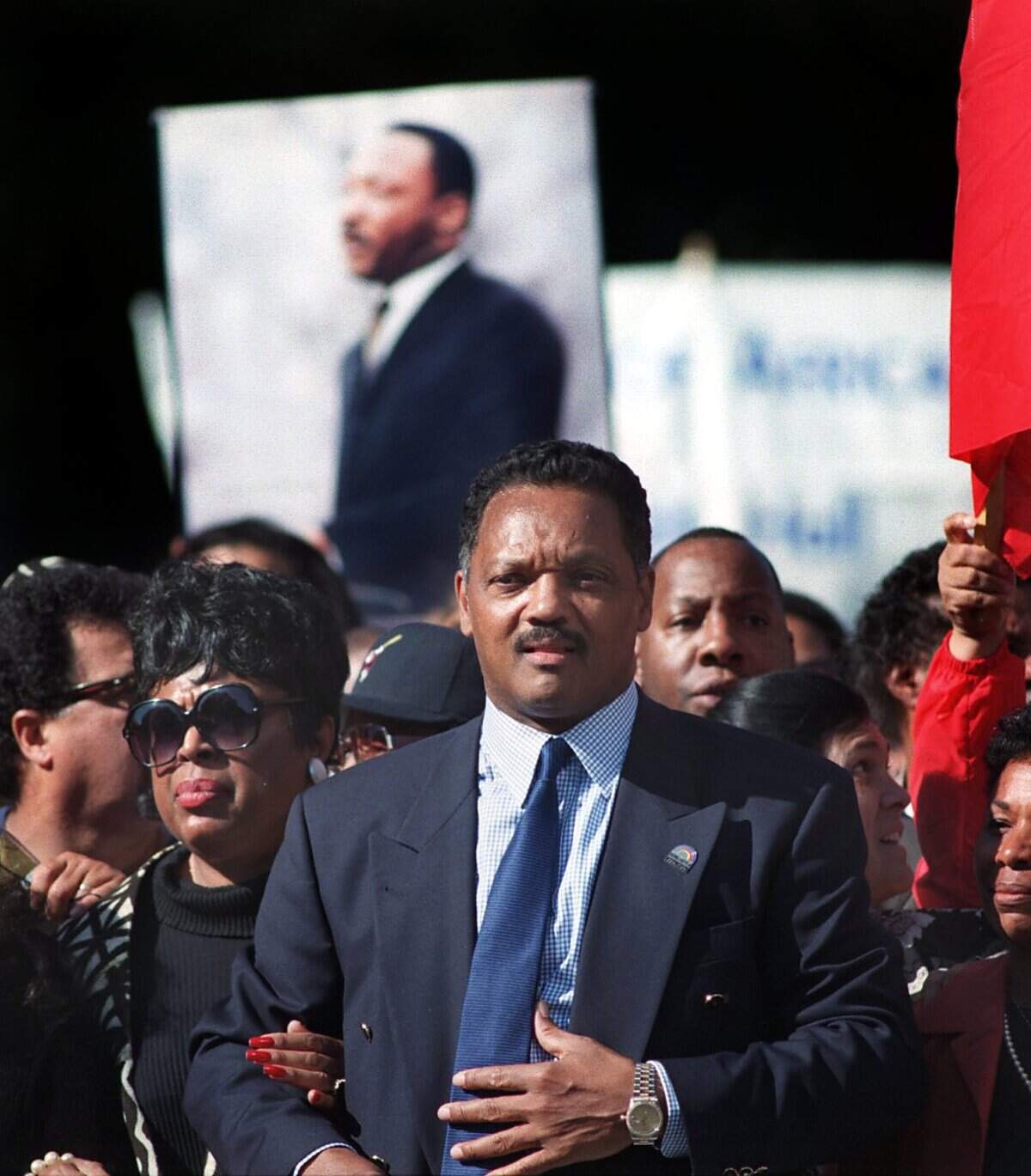 Rev. Jesse Jackson walks with state Sen. Diane Watson, D–Los Angeles, during at Save the Dream march on Oct. 27, 1997.
