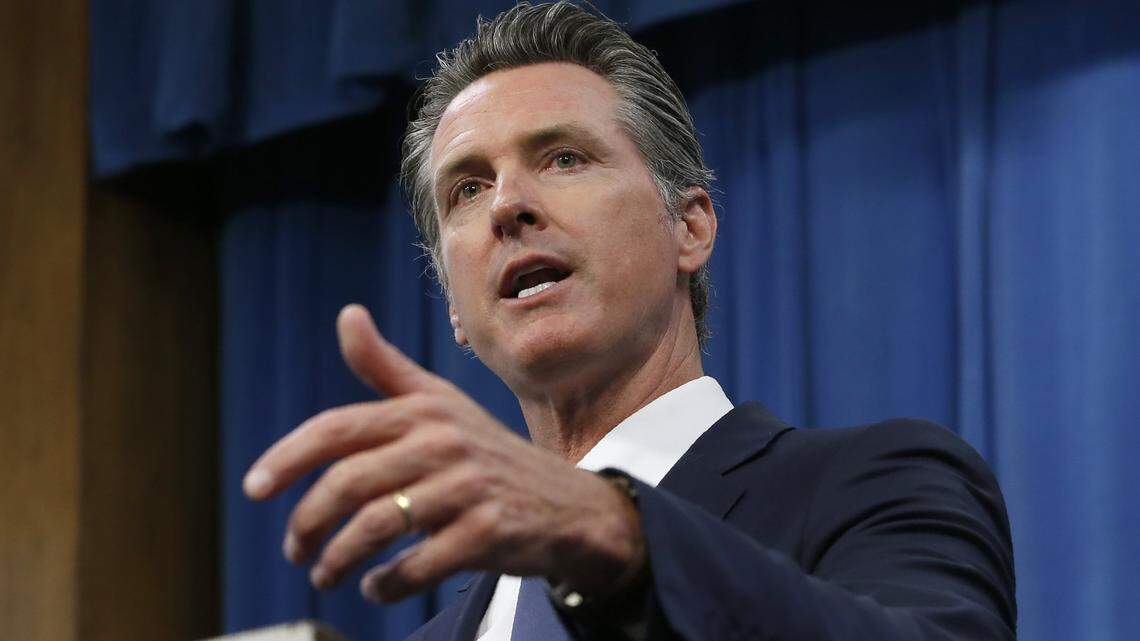 In this file photo, Gov. Gavin Newsom talks to reporters in Sacramento.