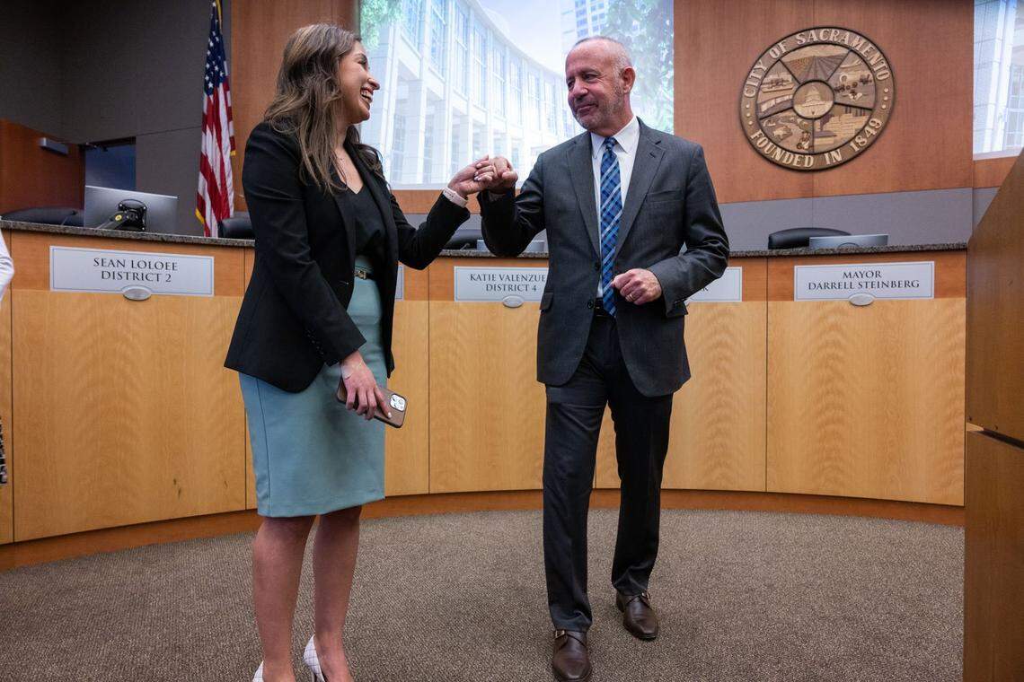 Sacramento Mayor Darrell Steinberg fist bumps Councilwoman Karina Talamantes inside the City Council chambers after he announced that he will not seek re-election on Thursday.