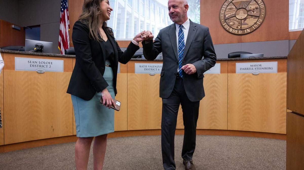 Sacramento Mayor Darrell Steinberg fist bumps Councilwoman Karina Talamantes inside the City Council chambers after he announced that he will not seek re-election on Thursday, May 25, 2023.