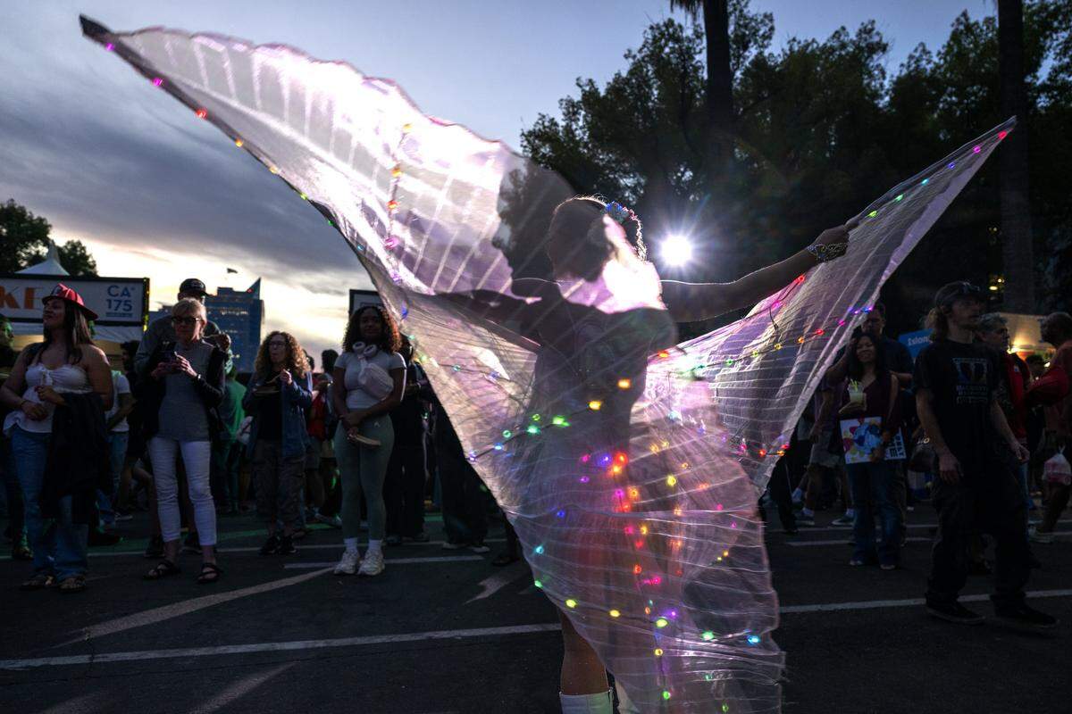 Erin Blaine of the Aries Moon Circus dances during a 175th birthday block party to celebrate California's anniversary of statehood on Tuesday, Sept. 9, 2025, at the state Capitol.