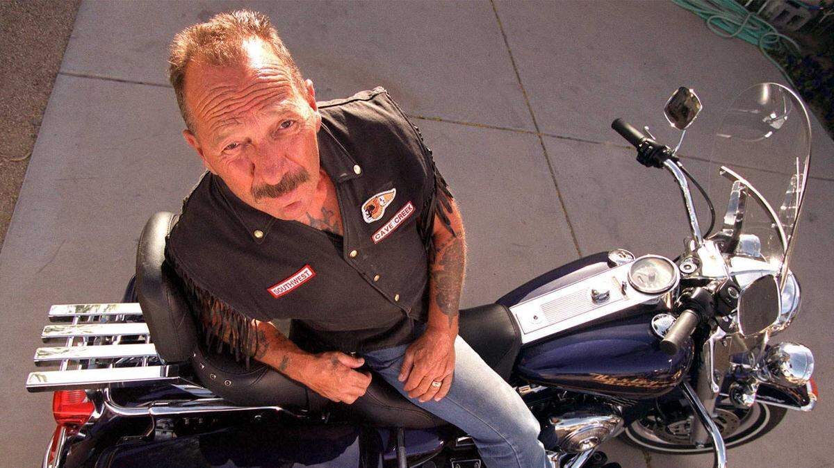 Sonny Barger, who started the Oakland chapter of the Hell’s Angels in the 1960s and ’70s and gave them their rep as outlaws, is seen with his motorcycle outside his home in Desert Hills, Ariz., in 2000. Barger will be memorialized Saturday in Stockton.