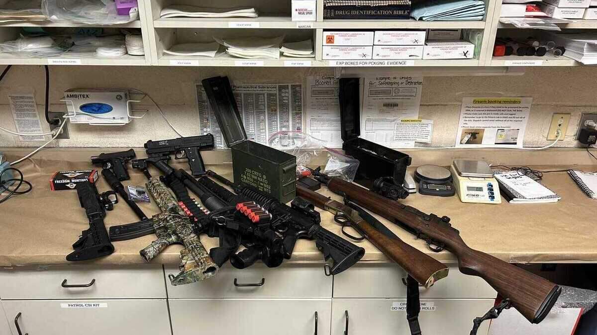 A collection of firearms, including assault rifles, are seen in a photo provided Thursday, Aug. 3, 2023, by the Folsom Police Department following the arrest of a man connected to a July incident in which a man pointed a weapon at motorists during road rage incident.