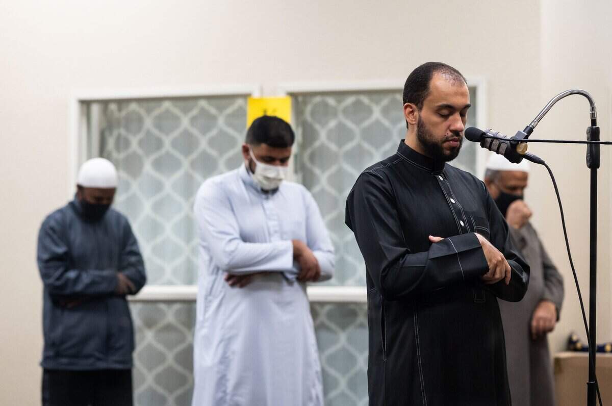 Imam Dr. Muhammad Najib recites the the Quran inside the Masjid Annur Islamic Center in south Sacramento on Tuesday. Taraweeh prayers usually run for about two hours, with the goal to finish all the pages of the Quran by the end of the holy month. However, with shortened services due to COVID-19 prevention measures, imams might only be able to finish half of those pages.