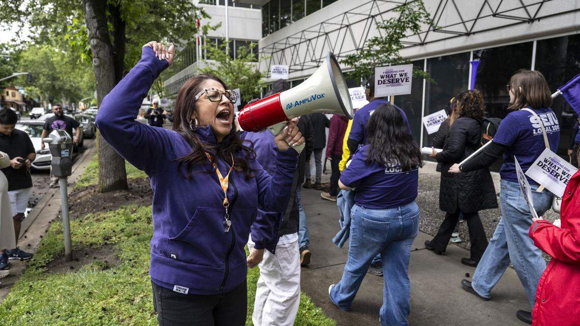 Anica Walls, president of SEIU Local 1000, leads a rally against the return-to-office mandate for state workers at the CalHR building on Wednesday, April 22, 2026. 