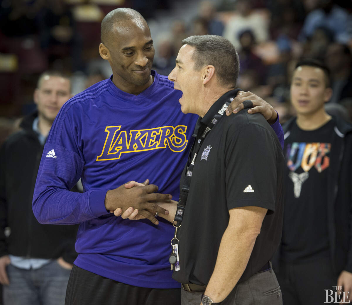 Los Angeles Lakers forward Kobe Bryant (24) talks with Chip Schaefer, director of sports science for the Kings.