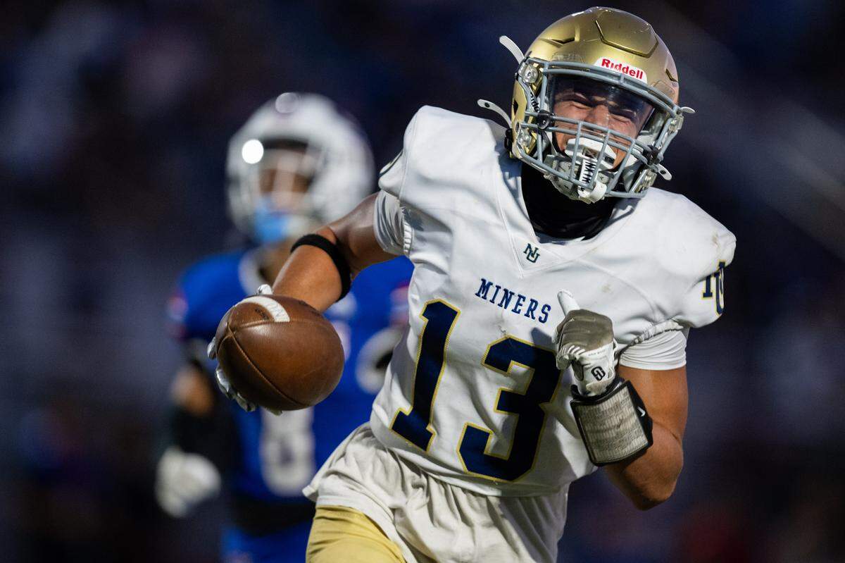 The Nevada Union Miners' Aiden Panock (13) scores a touchdown on a 55-yard reception  in the second quarter against the Christian Brothers Falcons in Sacramento on Friday.