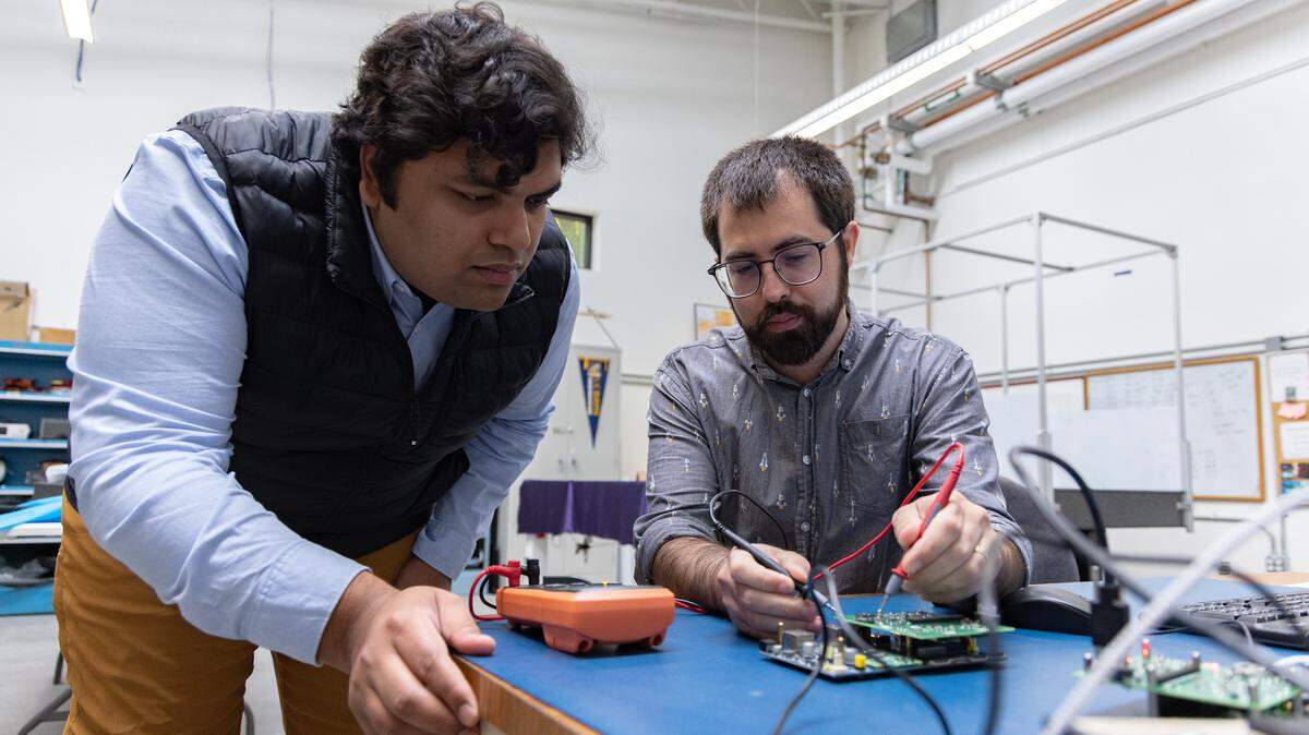 UC Davis graduate student Adam Zufall and Ayush Patanik work on the payload that will be launched alongside Proteus Space’s satellite in October. Zufall oversees the UC Davis part of the project in professor Stephen Robinson’s lab.