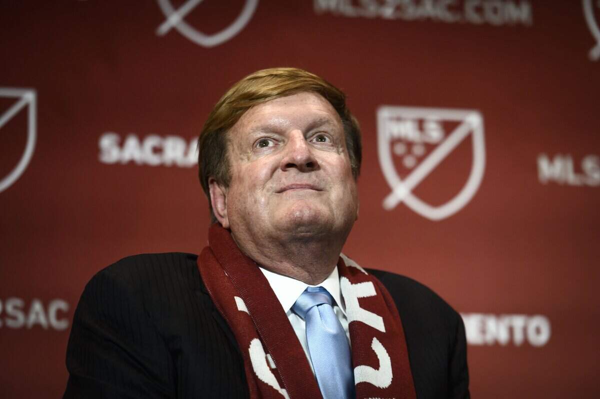 Grocery store magnate Ron Burkle sits on a stage in downtown Sacramento during a 2019 press conference announcing a Major League Soccer franchise for the city.  Burkle ultimately backed out of the agreement, citing business concerns relating to the COVID-19 pandemic.
