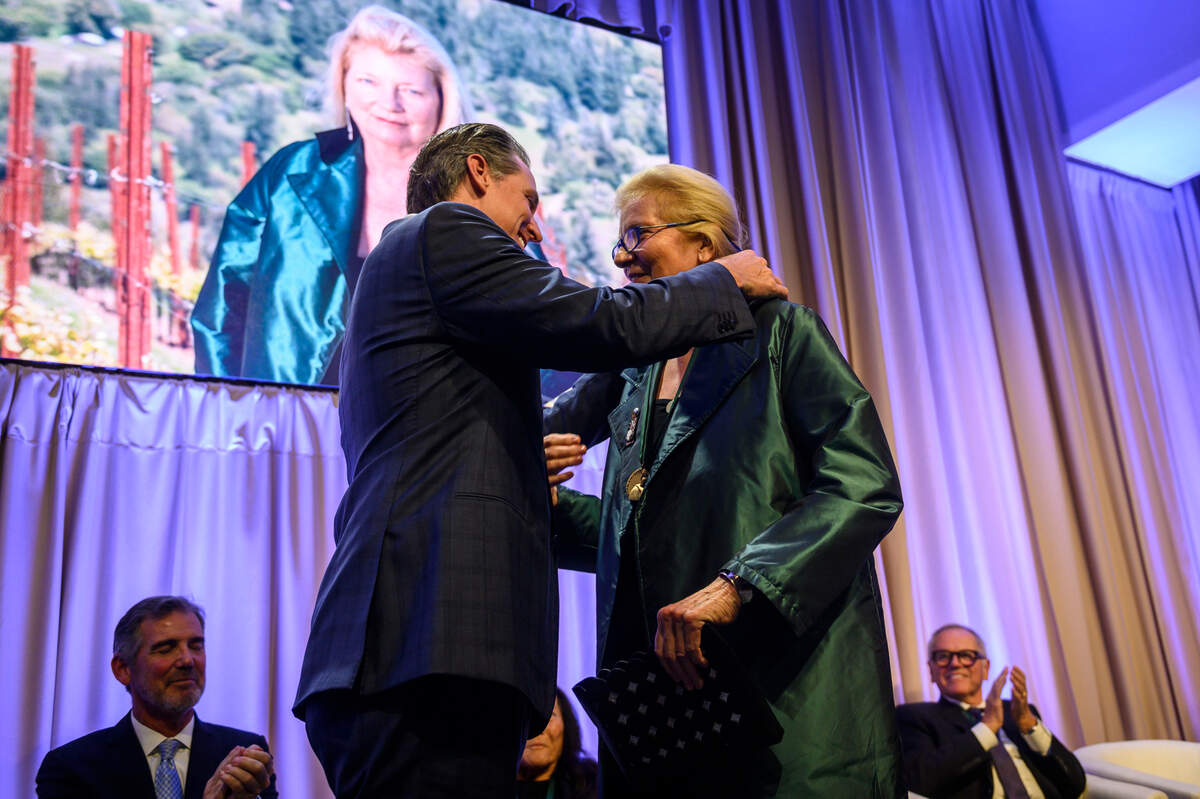 California Gov. Gavin Newsom honors winemaker Helen Turley at the 13th Annual California Hall of Fame ceremony at the California Museum in Sacramento, Calif., on Tuesday, Dec. 10, 2019. Turley moved to California in 1977 to begin making wines in Napa and Sonoma counties.