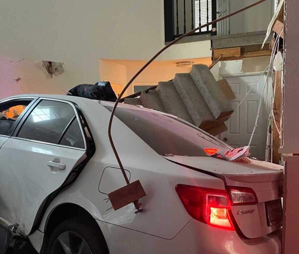 A white Toyota Camry rests after its driver crashed into a house on the 8200 block of Spengler Road in south Sacramento after a short pursuit with the Sacramento County Sheriff’s Office on Sunday, June 4, 2023. Amar Gandhi, a spokesman for the Sheriff’s Office, said the driver is expected to face charges.