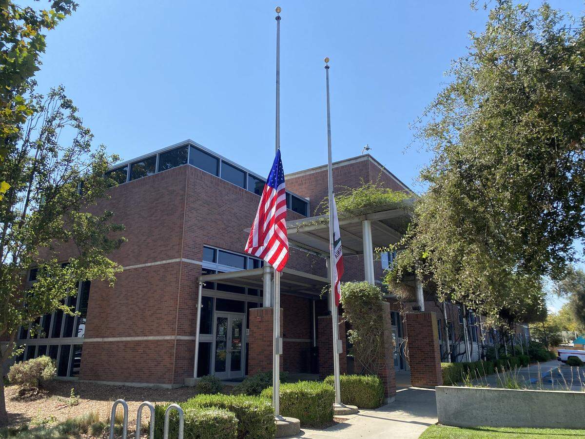 The American and California flags appear at half-staff in front of the Woodland Police Department on Sept. 12, 2025. US President Donald Trump issued a proclamation on Sept. 10 that all public institutions should fly their flags at half-staff through sunset Sept. 14 in honor of political activist Charlie Kirk, who was killed at a rally on Sept. 10.