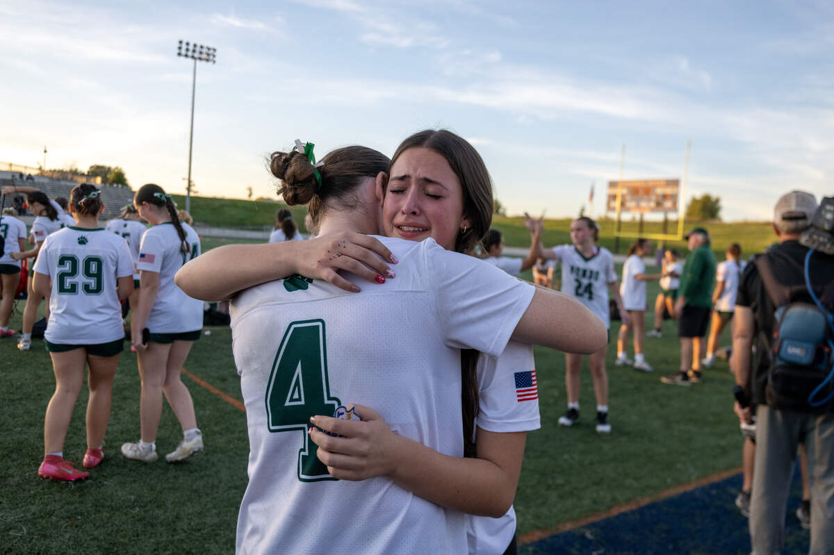 The Ponderosa Bruins Rowan Thomas (4) embraces Ellie Escobar following the 33-6 loss to the Merced Bears in the CIF Sac-Joaquin D ll Section Championship game on Saturday at Cosumnes River College in Sacramento.
