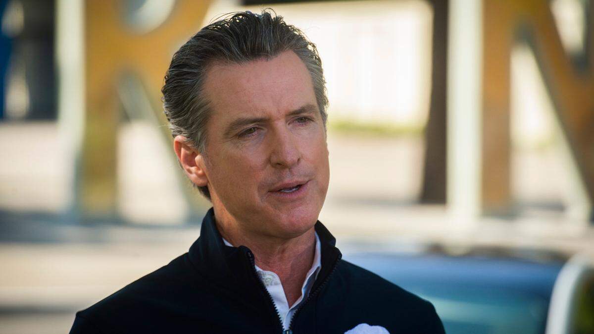 California Gov. Gavin Newsom announces an executive order requiring all new passenger vehicles sold in the state to be zero-emission by 2035, a move the governor says would achieve a significant reduction in greenhouse gas emissions, at a press conference on Wednesday, Sept. 23, 2020, at Cal Expo in Sacramento.