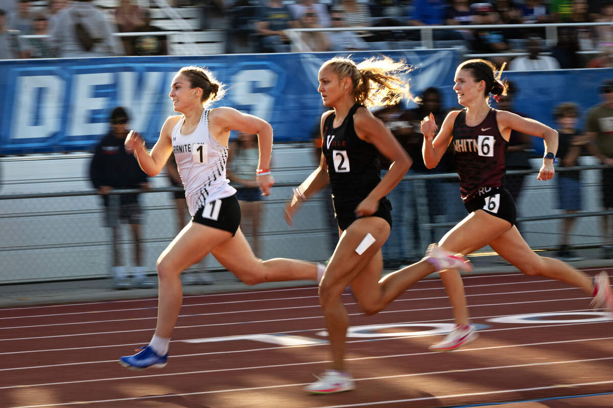 Granite Bay’s Kylie Nasca, left, Vacaville’s Khloe DeLaTorre, middle, and Ava Kopec of Whitney, right, run the final stretch in the girls 800 meter race at the CIF Sac-Joaquin Section Masters Track Championship at Davis High School in Davis, Calif., Saturday, May 18, 2024. Nasca won the race with a time of 2:16.02, DeLaTorre was second at 2:16.28 and Kopec finished third at 2:16.42.