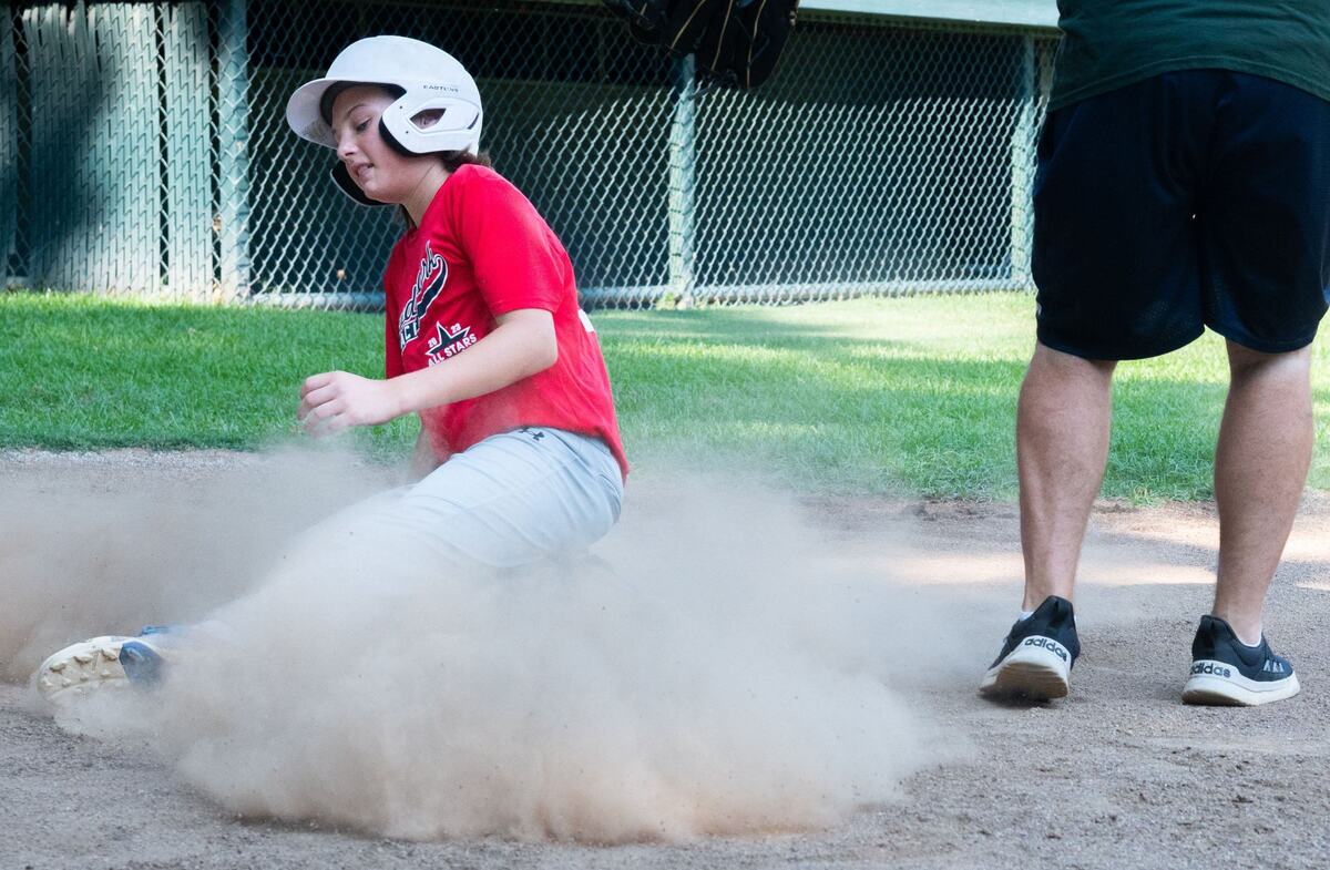 Liam Musante slides into home base during a drill on Monday, July 29, 2024, at Dooley Field in Sacramento. “My favorite thing about playing on this team is playing with friends and getting to hang out,” Musante said.