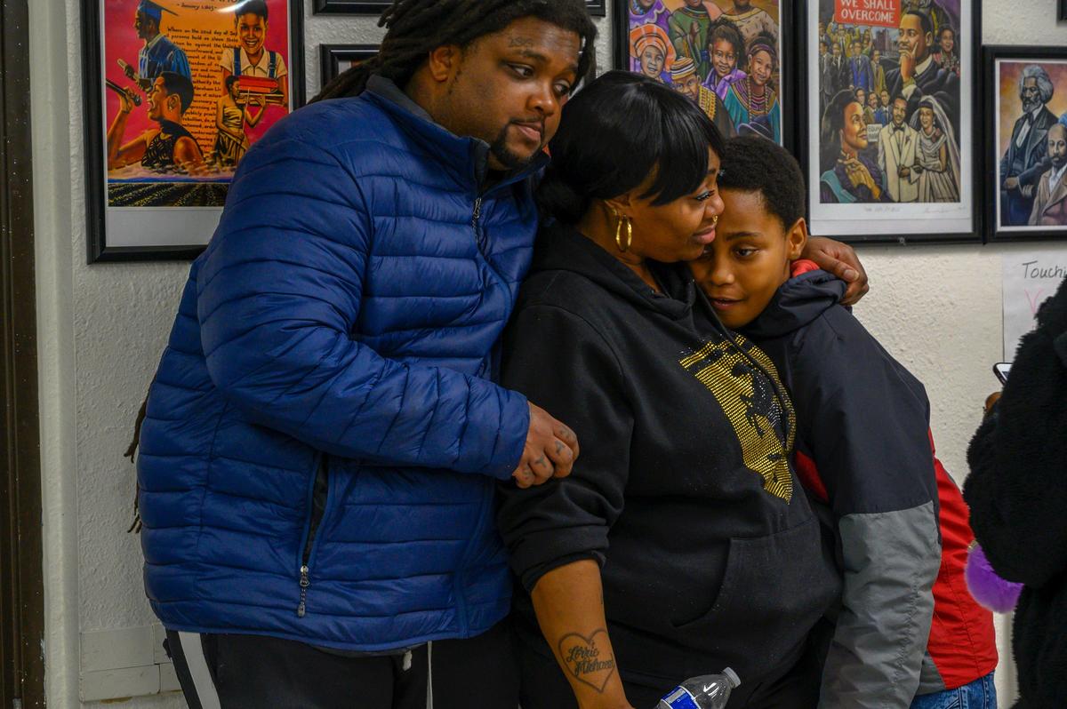 Dajha Richards’ family, step-father, Andre Douglas, left, mother, Ebony Douglas, center, and brother, Brian Richards, 13, comfort each other at a domestic violence victims support group for black women on Sunday, Feb. 10, 2019 in Sacramento. Brian Richards was home when his sister Dajha was shot and killed and the family worries about the impact on him. Damion Horton, 21, her boyfriend and father of their infant son, was charged with the murder.