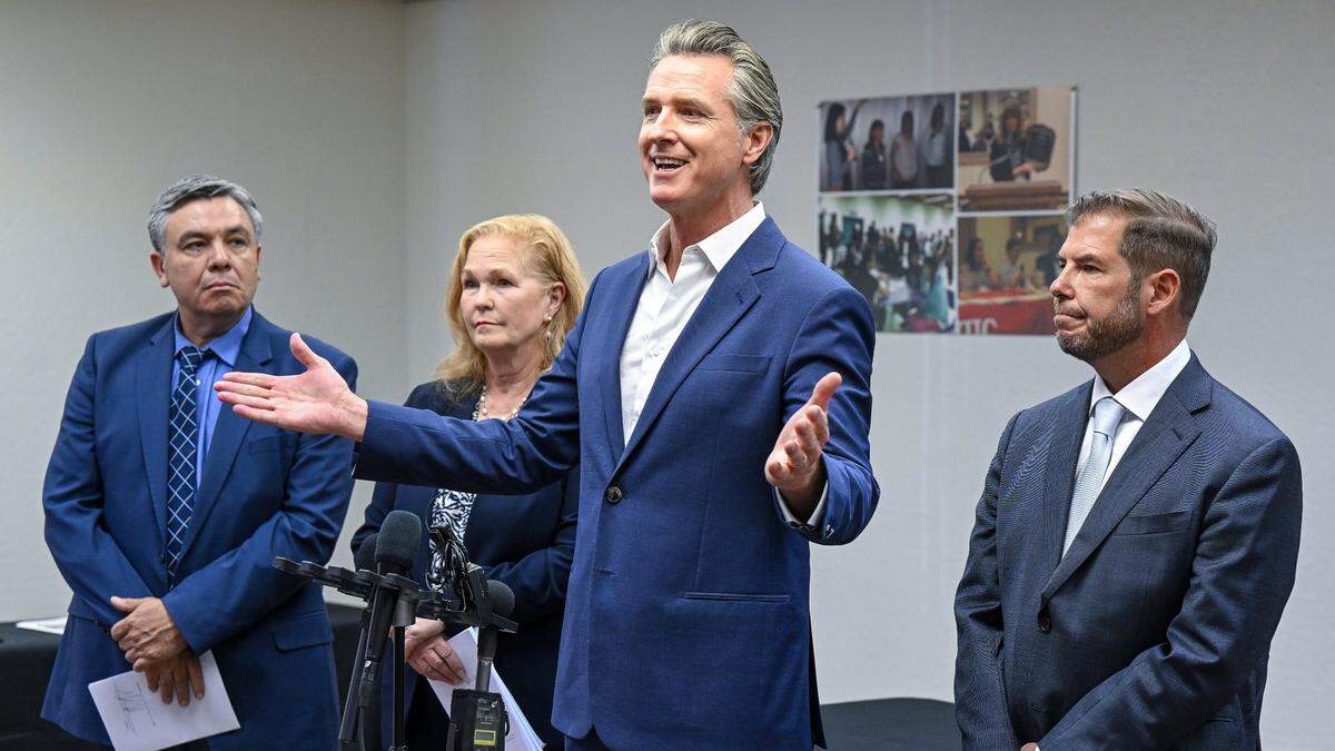 Gov. Gavin Newsom, center, speaks to the media as assemblymembers Juan Carrillo, from left, Gail Pellerin and Joaquin Arambula watch after signing Assembly Bill 2240, a farmworker housing bill, on Tuesday, Sept. 24, 2024. He vetoed Arambula’s bill to help undocumented immigrants with home loans.