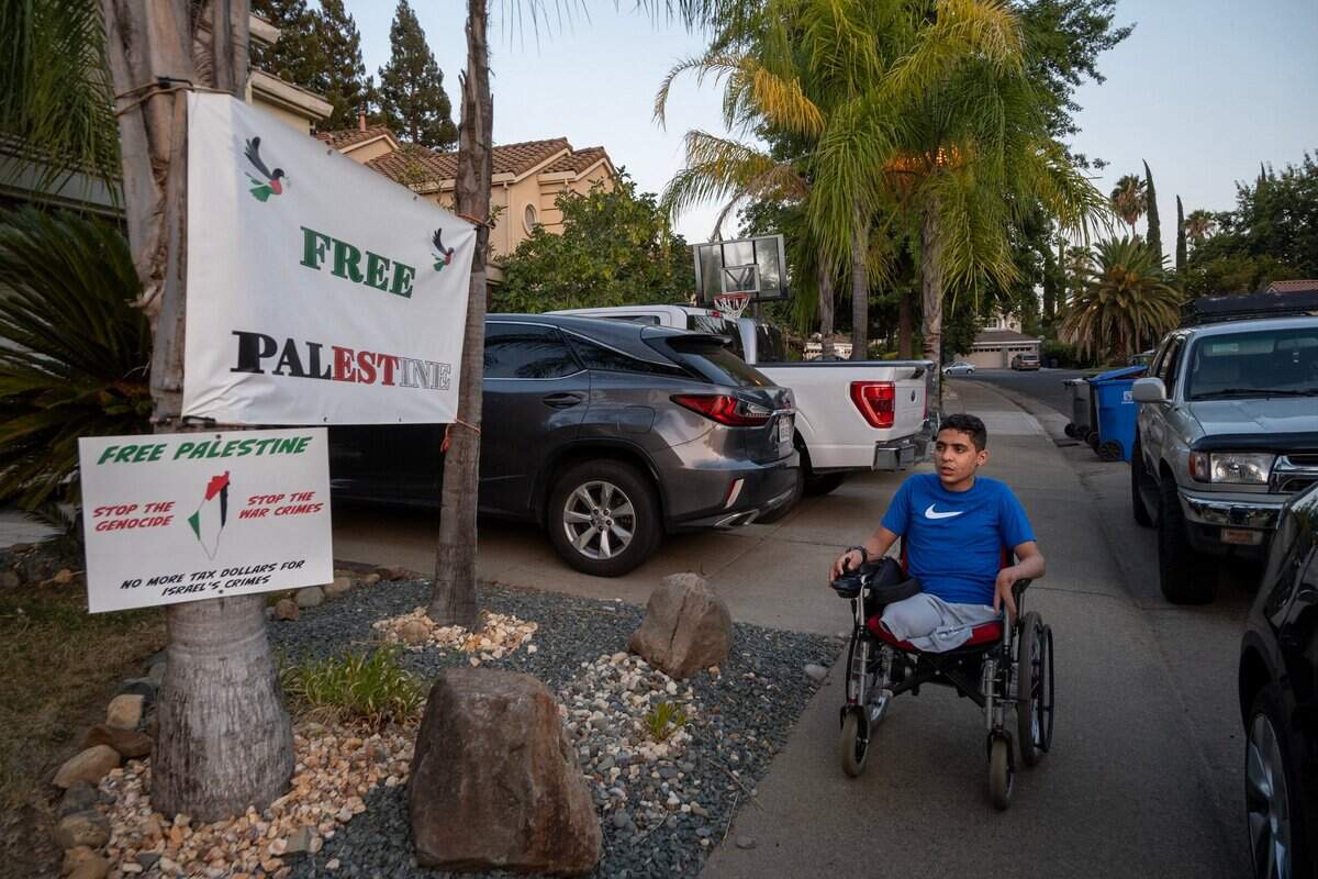 Ahmed rides his electric wheelchair outside his host family’s home in September in Folsom. Ahmed’s mother is worried her son won’t survive if he has to return to Gaza.