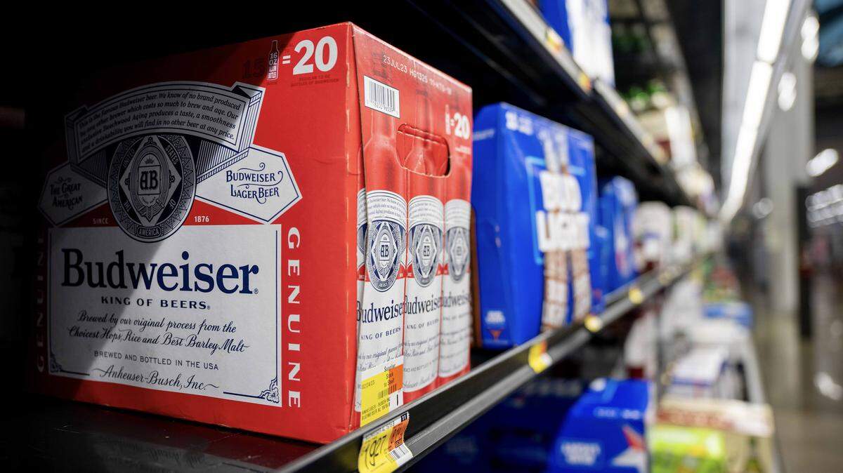 Budweiser beer awaits purchase at a discount retailer. 