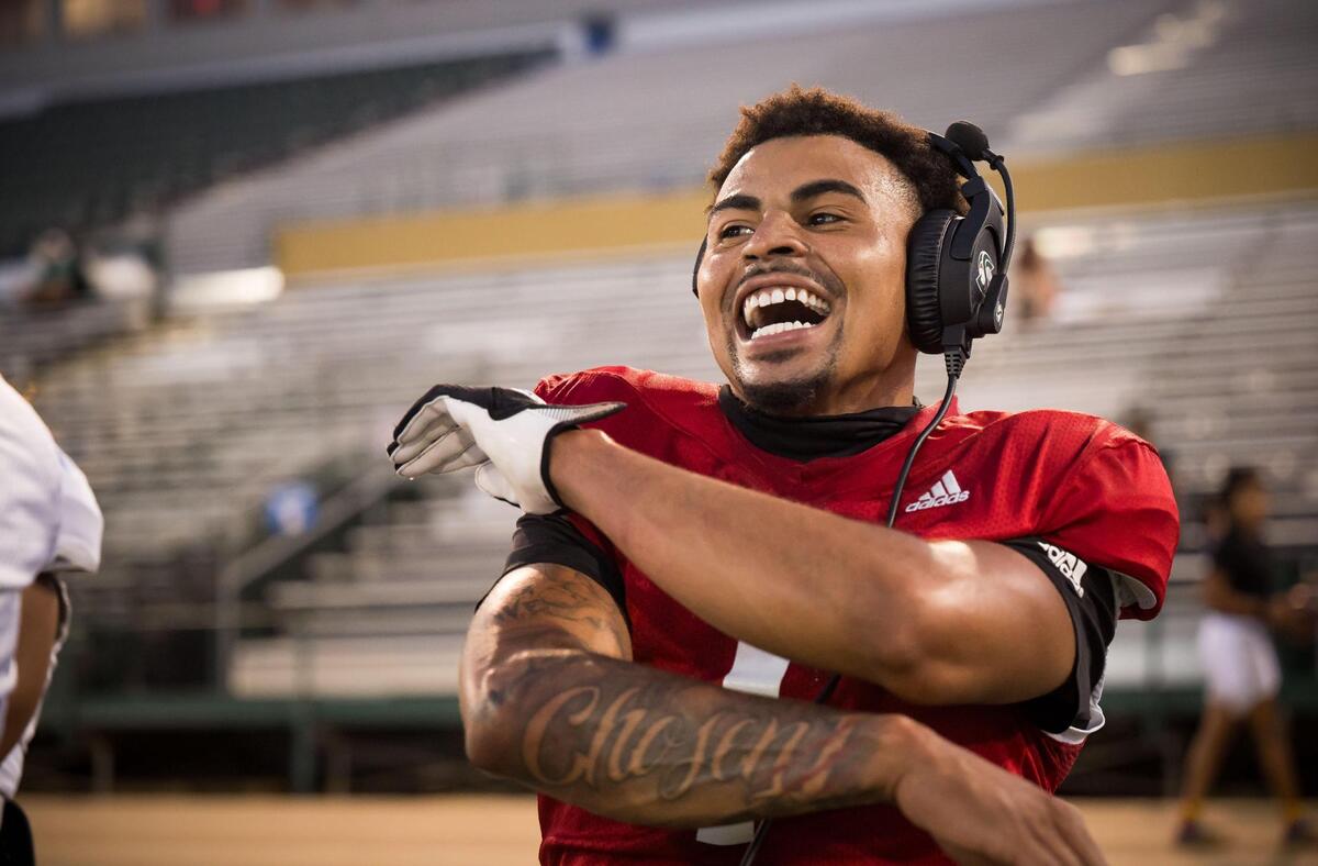 Sacramento State quarterback Kaiden Bennett celebrates teammates’ playing during a football scrimmage earlier this month at Hornet Stadium.