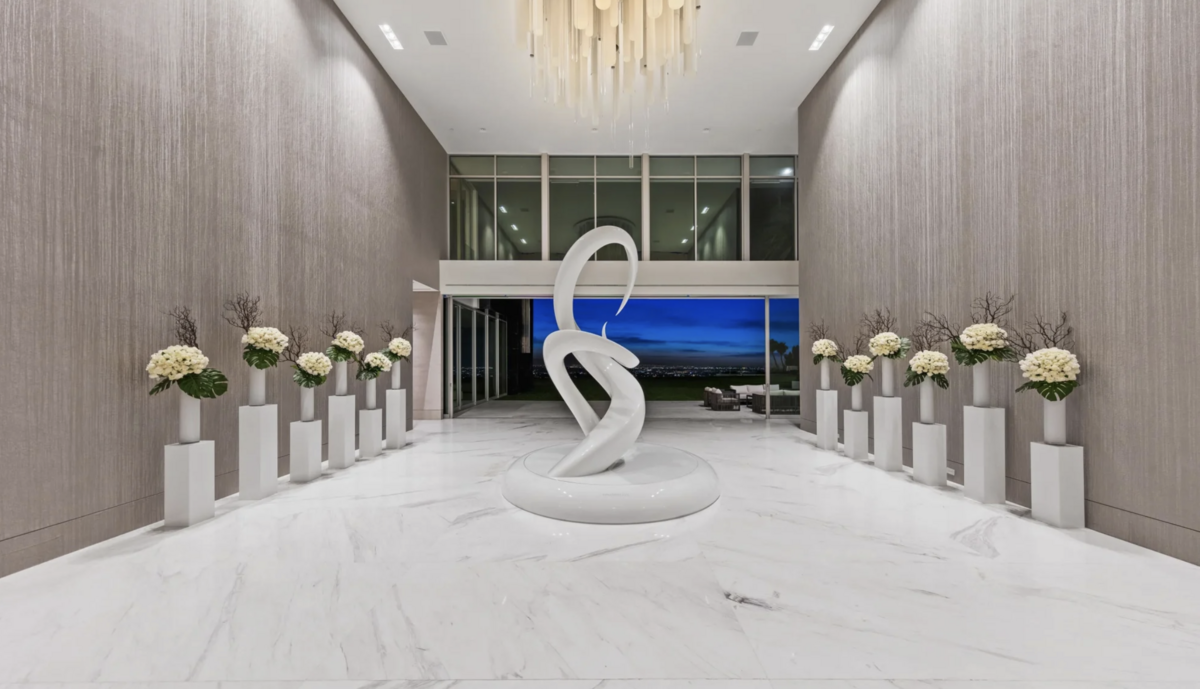 The mammoth house comes with 21 bedrooms, 49 bathrooms, five pools, six elevators and a 20-car garage, according to the auction website.