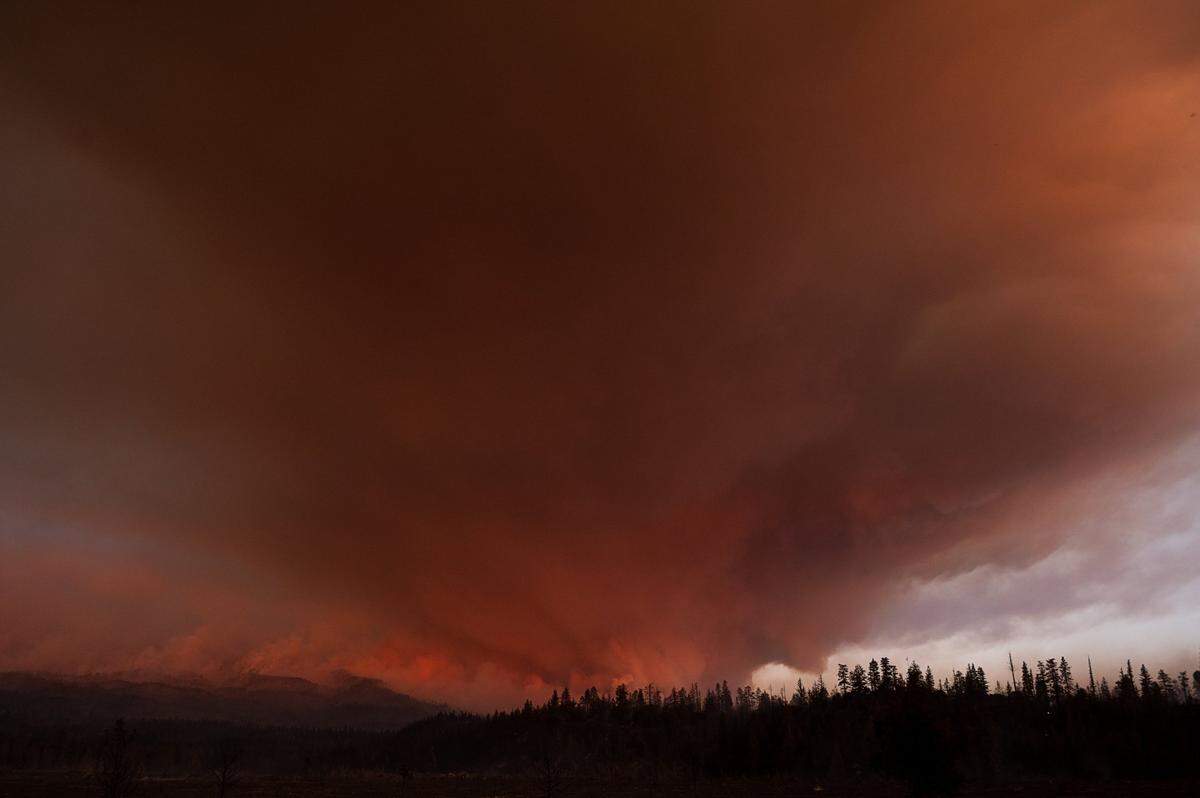 Smoke billows into the sky near the slopes of Mt. Shasta looking east from Highway 97 near Weed during the Lava Fire.