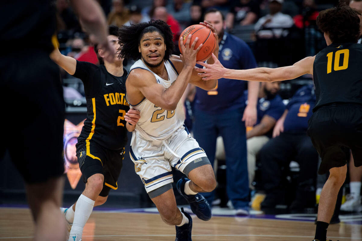 Elk Grove’s Ameere Britton drives to the basket past Foothill of Santa Ana players in the second half of the CIF state division II basketball championship game on Saturday, March 12, 2022, at Golden 1 Center.
