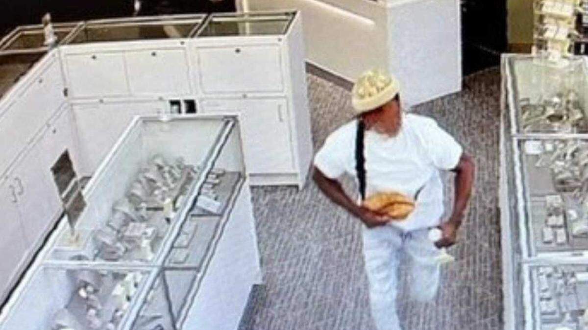 A man, accused of grabbing jewelry from a case and assaulting a store employee during a robbery, is seen on surveillance imagery from Kay Jewelers in the Folsom Premium Outlets on June 1, 2023. The suspect was later arrested following a short pursuit with law enforcement in Stockton, officers said.
