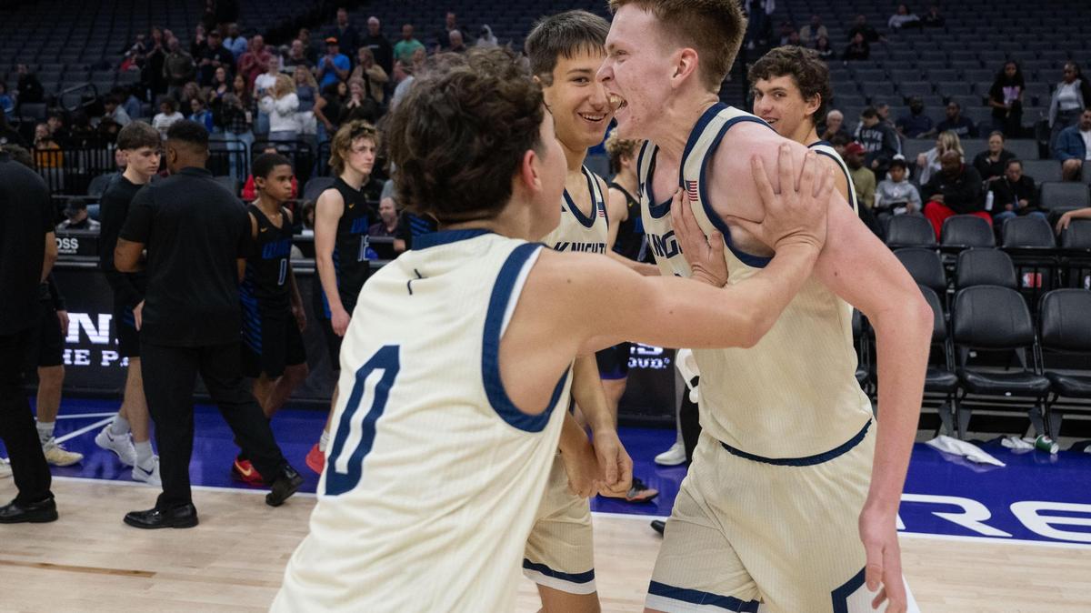 Stone Ridge Christian Knights’ Marcus Parker (0) celebrates his team’s victory with Tyler Mccabe (22) after a CIF Sac-Joaquin Section Division VI boys basketball championship game against Sacramento Waldorf at Golden 1 Center on Thursday.