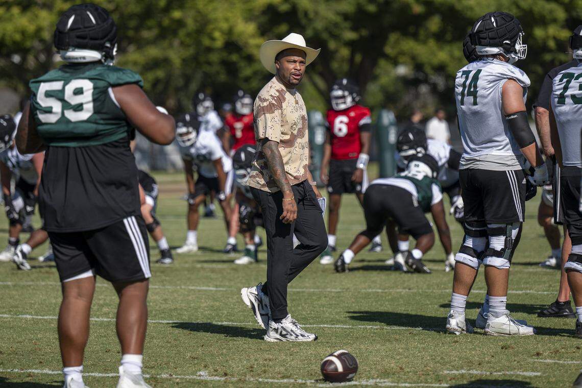 Brennan Marion, Sacramento State’s football coach, walks on the field during the first practice of the 2025 season in Sacramento on Aug. 1. The Hornets open the season Saturday at South Dakota State.
