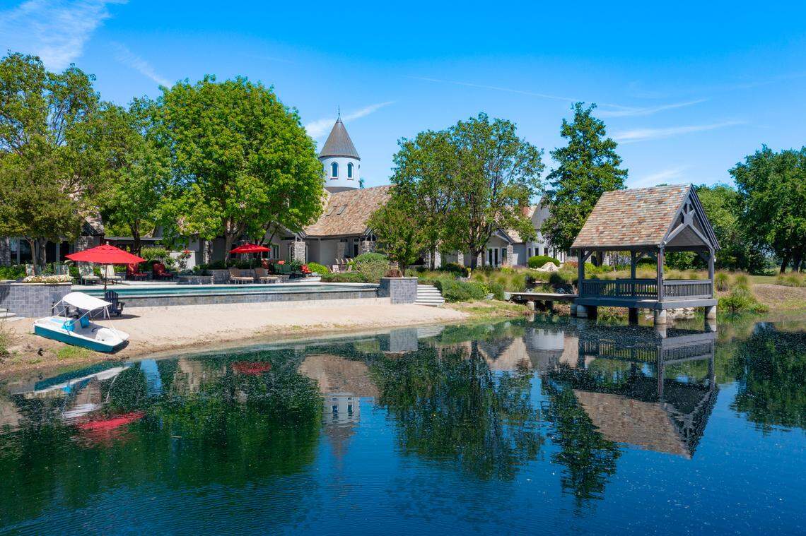 The observation turret rises above the 25-by-40-foot infinity edge pool and 1½-acre lake with a sandy beach.