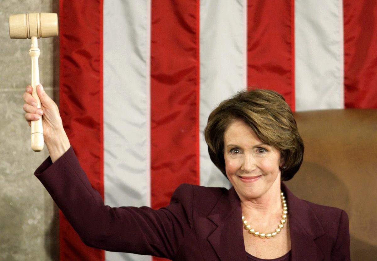 Speaker of the House Nancy Pelosi , D-Calif., holds up the Speaker's gavel after becoming the first female Speaker during a swearing in ceremony for the 110th Congress in the House Chamber of the U.S. Capitol on Jan. 4, 2007 in Washington, D.C.