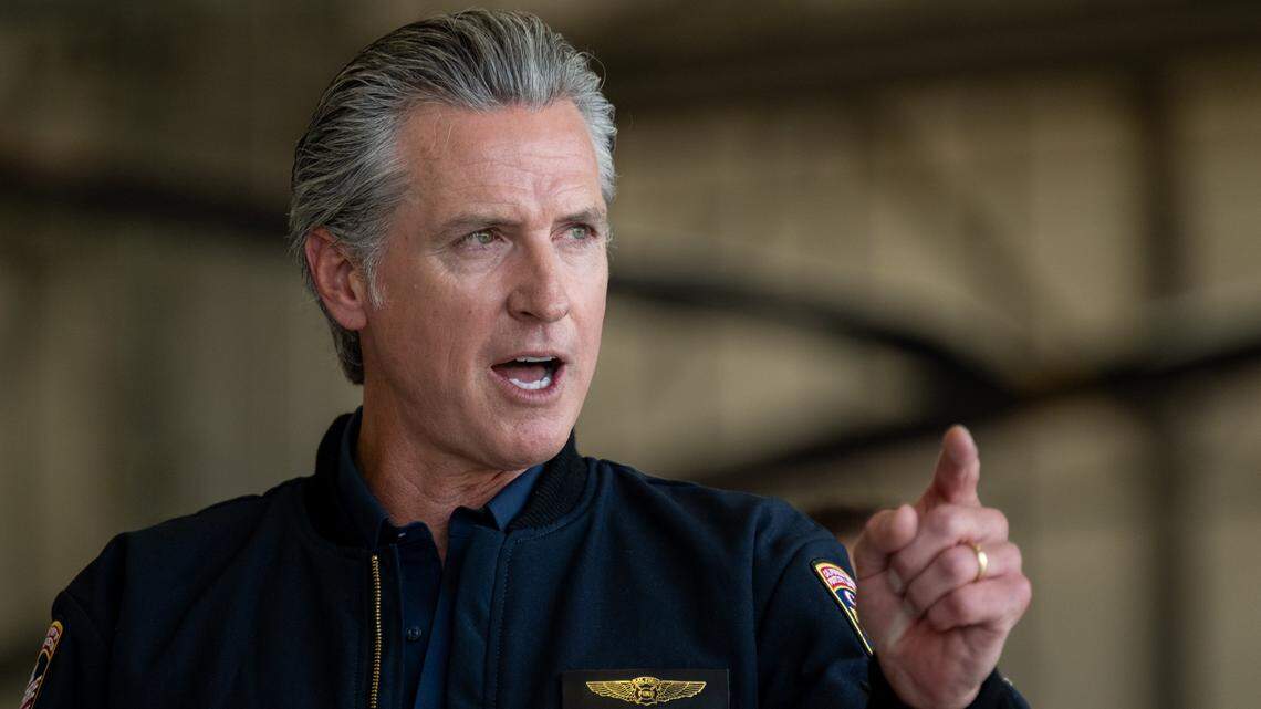 Gov. Gavin Newsom speaks at a news conference at McClellan Airport on July 31 in Sacramento. 