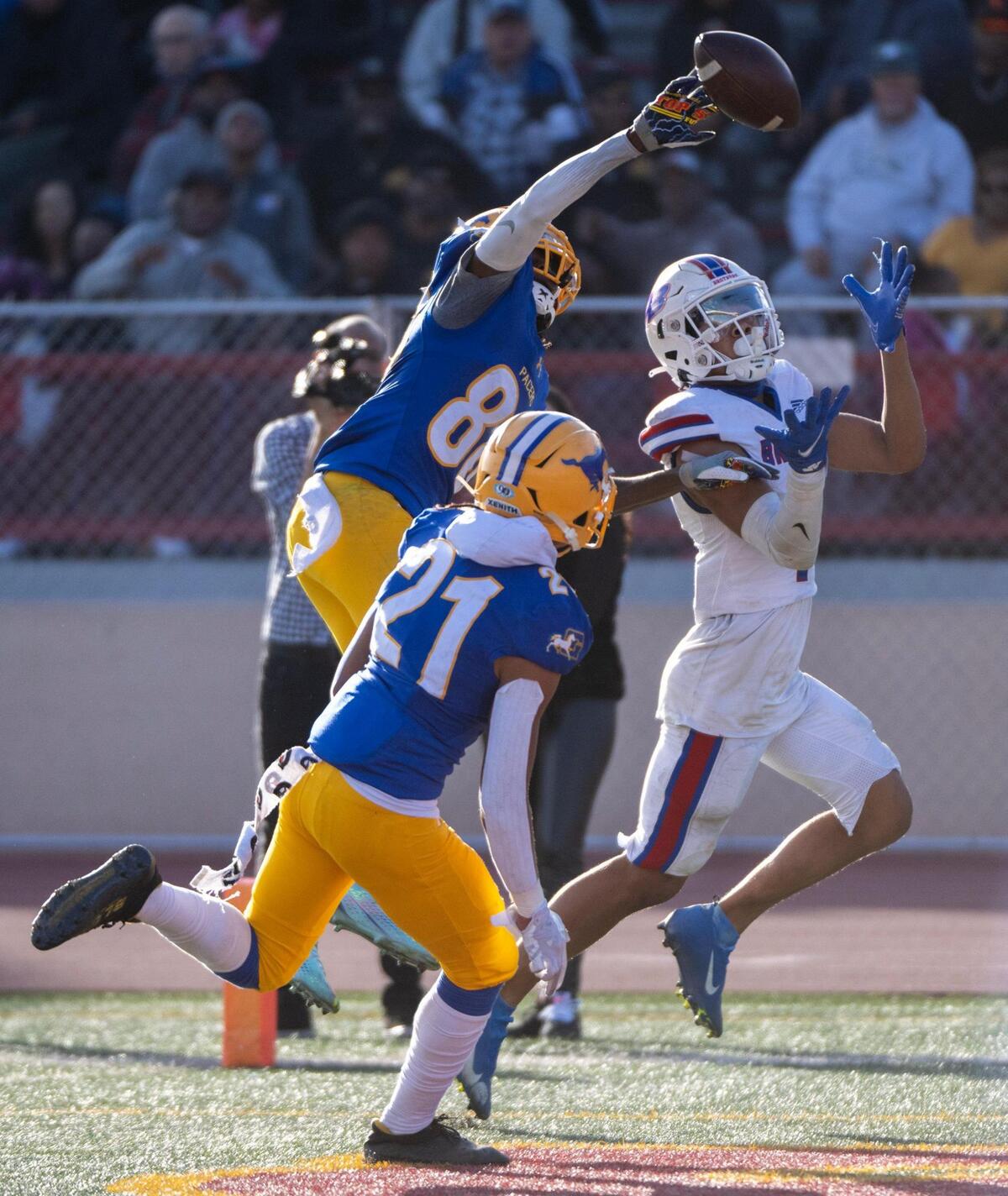 Grant High School’s Maurice Davis bats the ball away from Christian Brothers’ Phillip Bell in the end zone during the CIF Sac-Joaquin Division III section championship at Hughes Stadium in Sacramento on Friday.