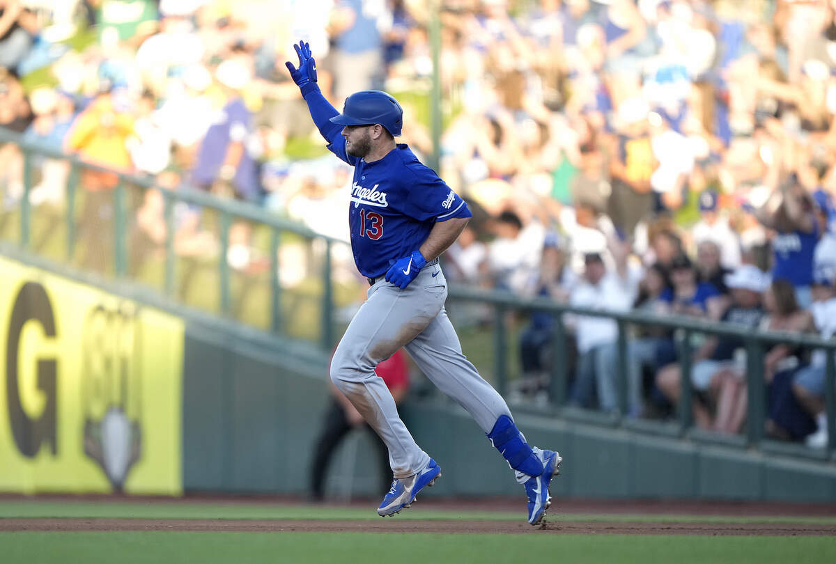 Max Muncy (13) of the Los Angeles Dodgers trots around the bases after hitting a solo home run against the Athletics in the top of the fourth inning at Sutter Health Park on Monday. Dodgers Muncy called playing with his same-named A’s counterpart “weird” after the game, but called the younger Max Muncy a “good kid.”