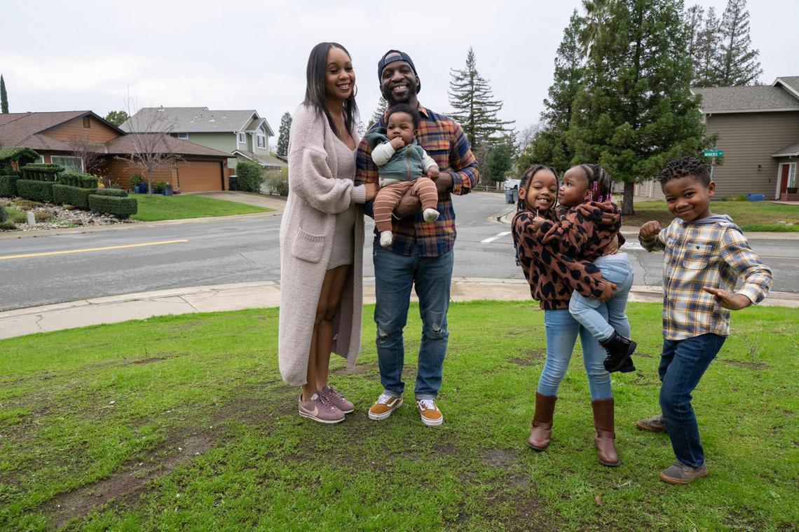 Boomer and Kim Bennett stand with their four children Royal, 6, Ivory, 8, King, 4-months, and Rylee, 2, at their home in Rocklin on Tuesday. More Black families are moving to Placer County, according to U.S. Census data.