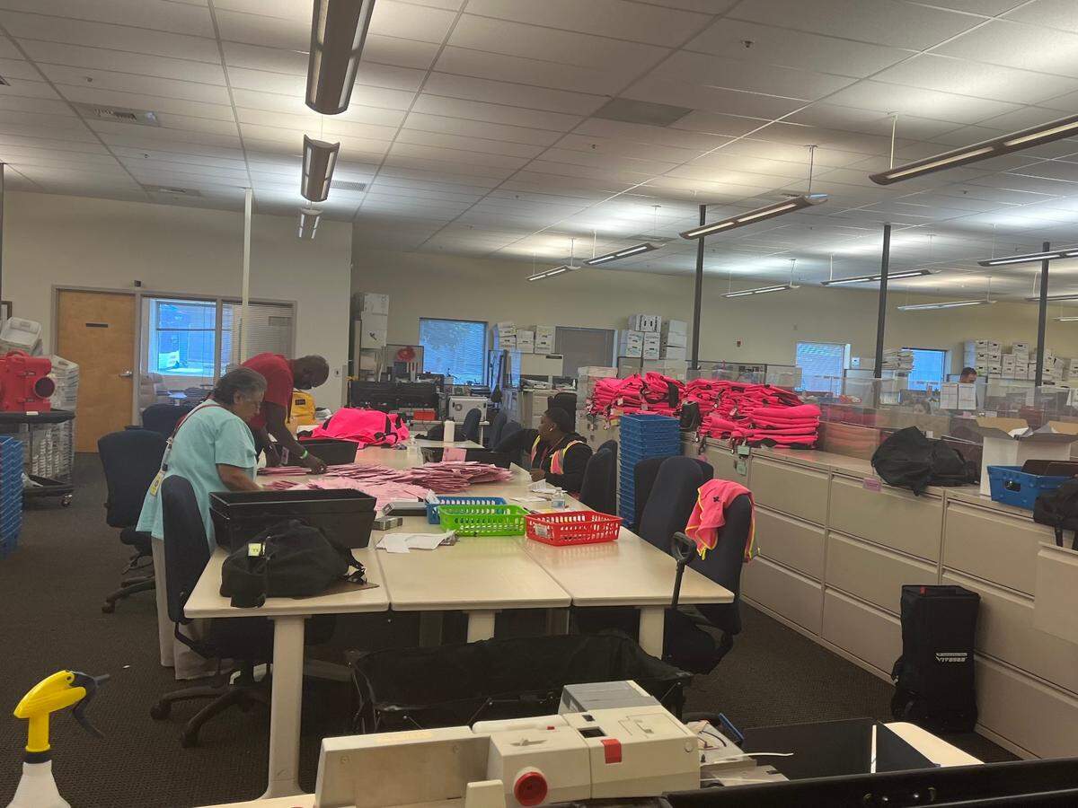 Election employees organize ballots and check signatures during the 2022 California primary on Tuesday June 7. 1,000 temporary employees facilitate ballot counting at the Sacramento County Voter Registration and Elections Office in South Sacramento.