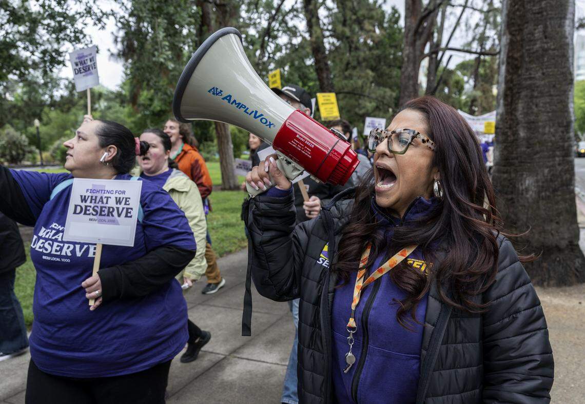 Anica Walls, president of SEIU Local 1000, leads a Sacramento march from Capitol Park to the CalHR building against Gov. Gavin Newsom's return-to-office mandate for state workers on Wednesday.