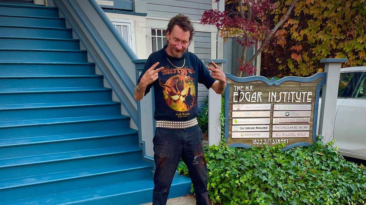 Charles “Ground Chuck” Thomas is pictured in December 2024 in Sacramento with his chalk-art creation.
