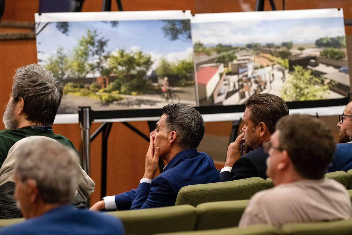 Brian Pedro, director of Sacramento’s Department of Community Response, center, listens Tuesday at a City Council meeting to the discussion about his proposal to charge homeless seniors fees to live in micro-communities.