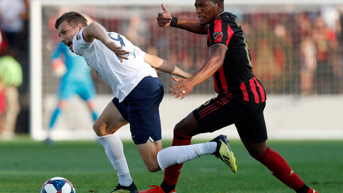 Saint Louis FC forward Russell Cicerone (9) works against Atlanta United midfielder Darlington Nagbe (6) during the first half of a U.S. Open Cup Quarterfinal soccer match Wednesday, July 10, 2019, in Kennesaw, Ga. (AP Photo/John Bazemore)