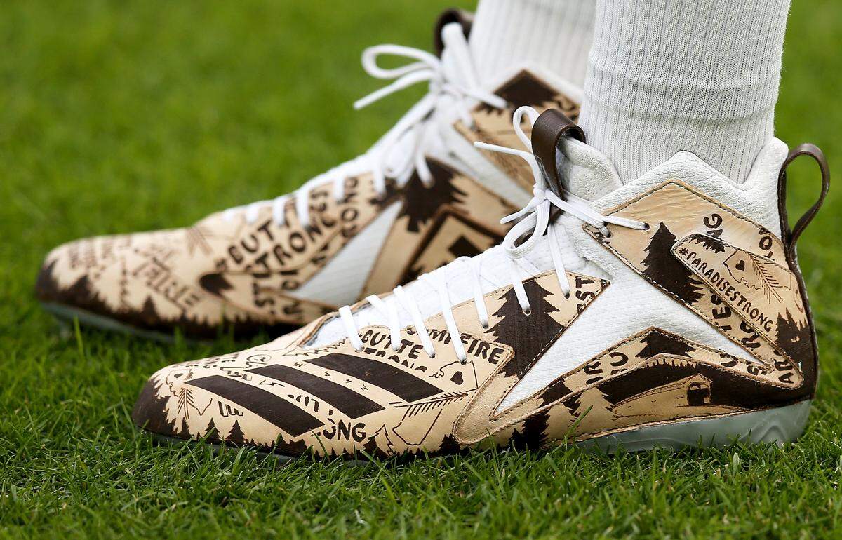 GREEN BAY, WISCONSIN - DECEMBER 08: A detail of the cleats worn by quarterback Aaron Rodgers #12 of the Green Bay Packers game at Lambeau Field on December 08, 2019 in Green Bay, Wisconsin. (Photo by Dylan Buell/Getty Images)