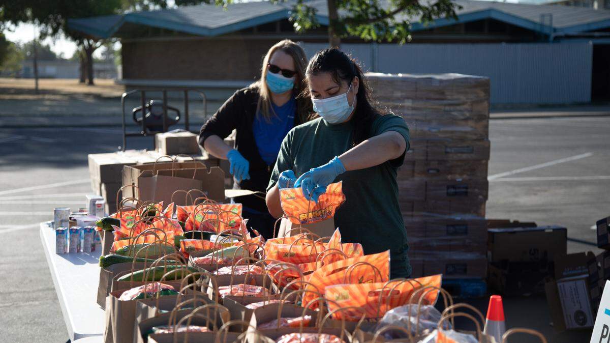 Bags are prepared for the Sacramento City Unified School District mobile food pantry on June 29, 2022.
