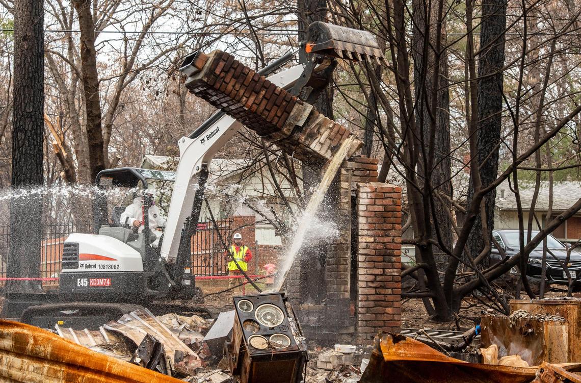 The first chimney is knocked down on Wednesday, Jan. 30, 2019 on Roberts Road in Paradise as part of the first significant phase of the city’s cleanup.