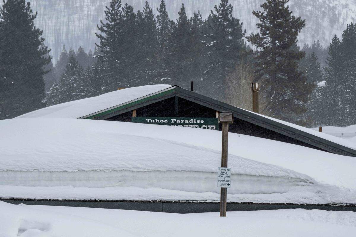 The Tahoe Paradise Golf Course entrance building in South Lake Tahoe is obscured by snow on Monday, March 6, 2023 in El Dorado County.