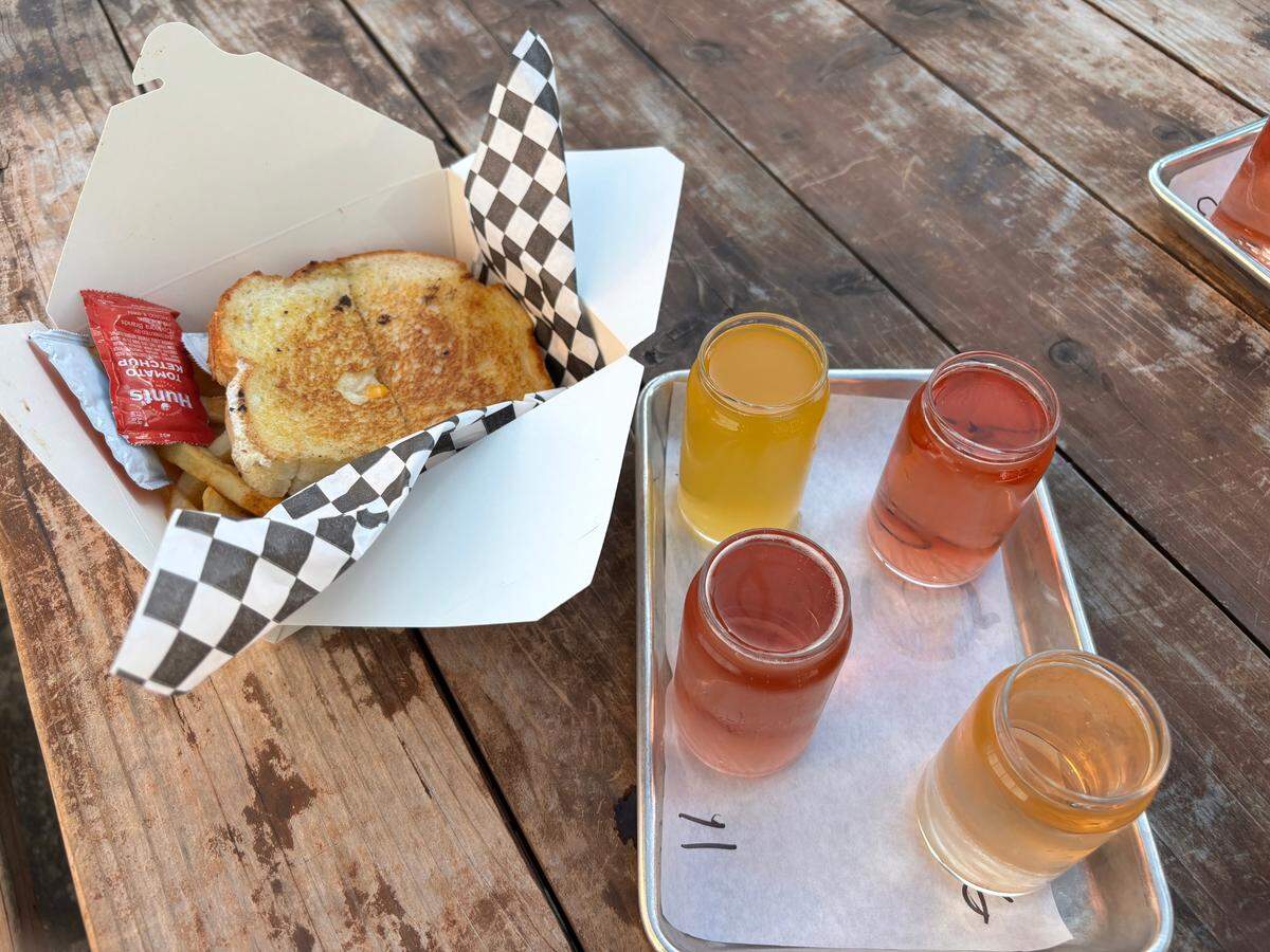 Sacramento Bee reporter Camila Pedrosa tried an Ultimate Grilled Cheese and fries from Tipsy Cheese to accompany a four-cider flight at Nitty’s Cider, which cost $22 total.