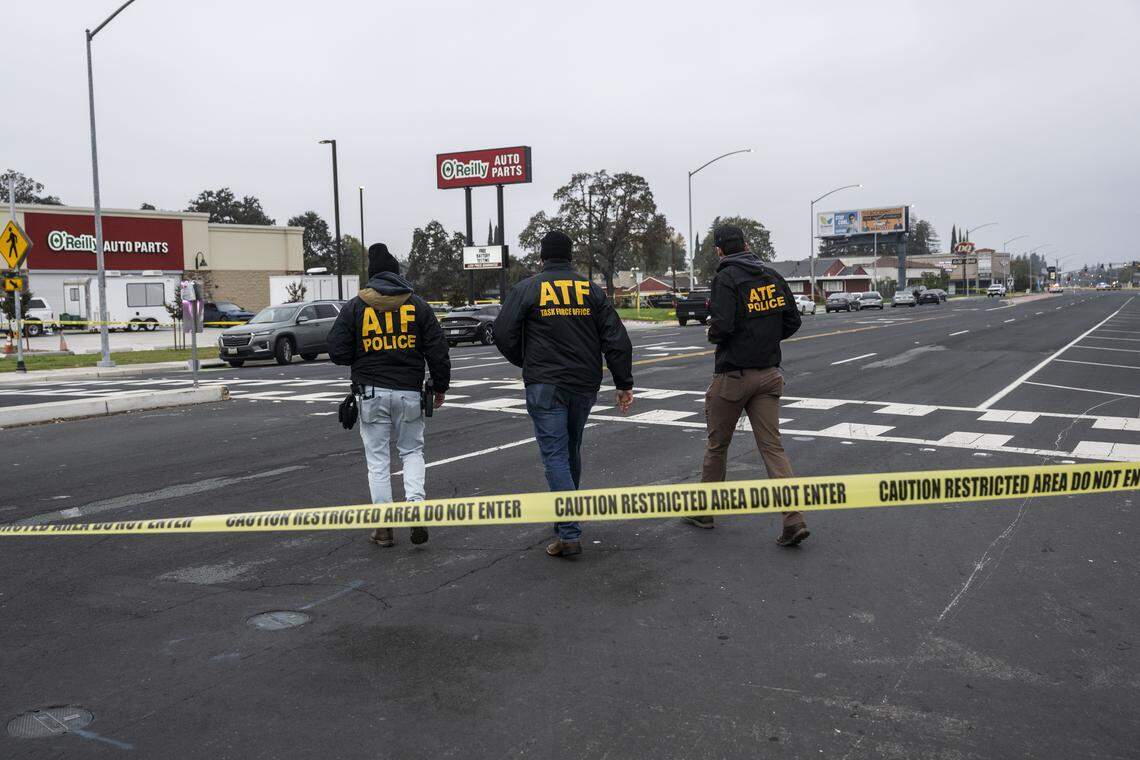 ATF officers walk on Sunday, Nov. 30, 2025, to the site of a mass shooting near Stockton the night before. 