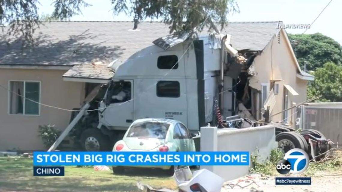 A stolen big rig chased by police slammed through utility poles and a cinderblock wall into a house Saturday in Chino, California, officers say.