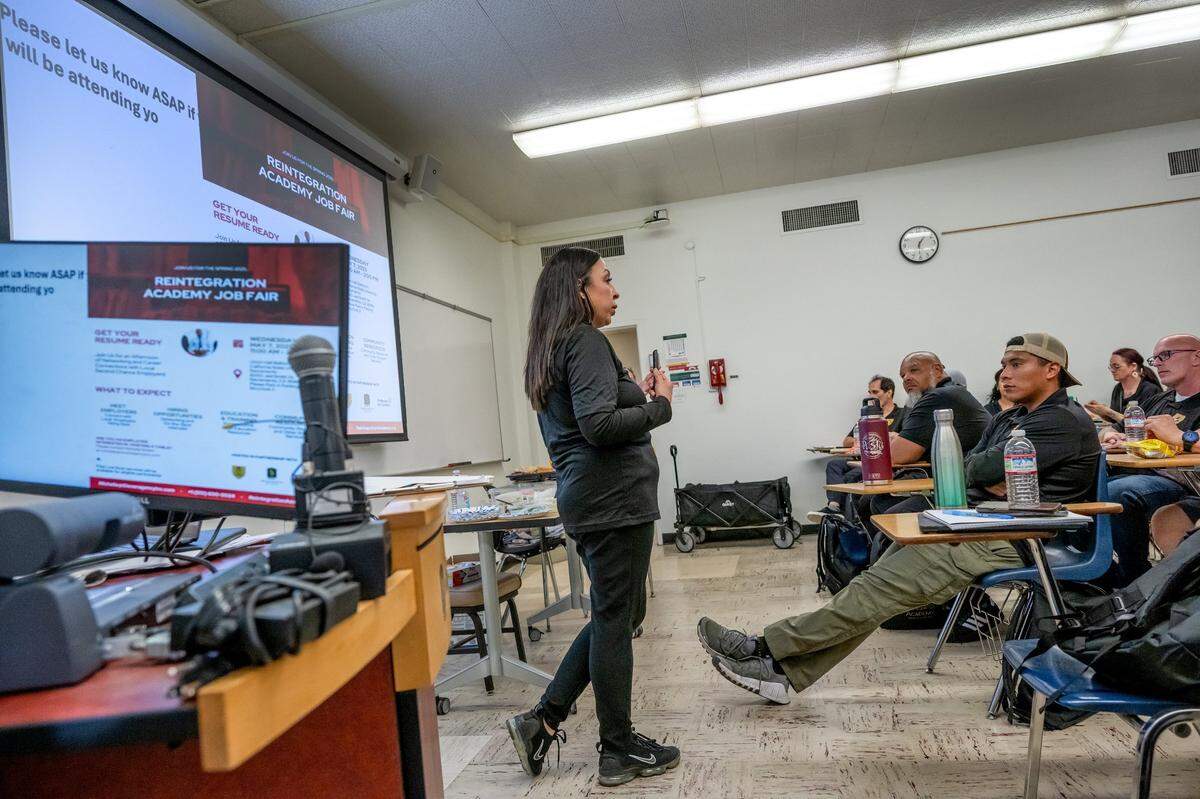 Michelle Sotelo instructs formerly incarcerated students how to interview for jobs at a Reintegration Academy class last month at Sacramento State.